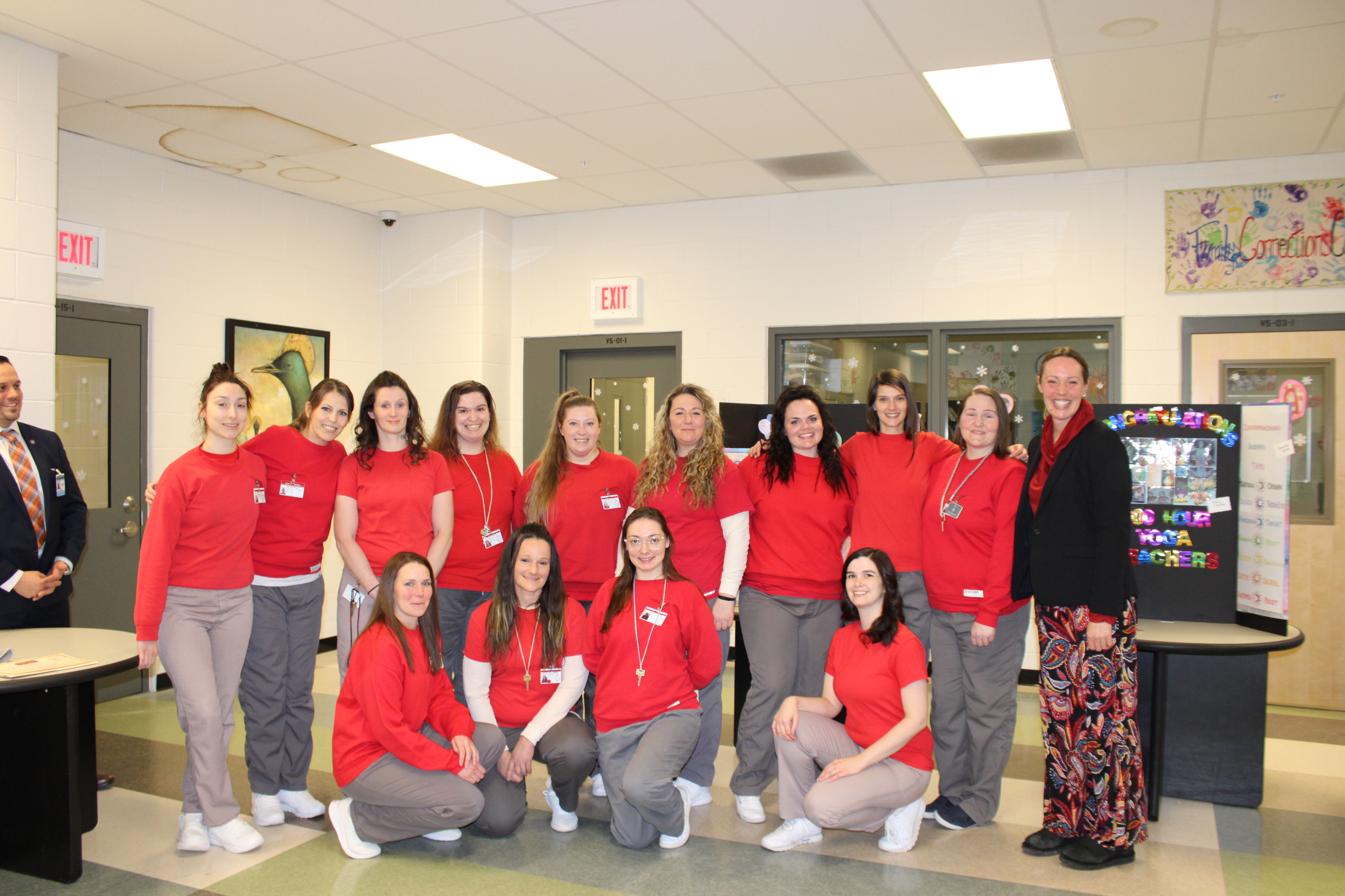 Graduates of Prison Yoga Project’s 2024 Yoga Teacher Training at the New Hampshire Correctional Facility for Women, pictured with trainer Jen Lindgren.